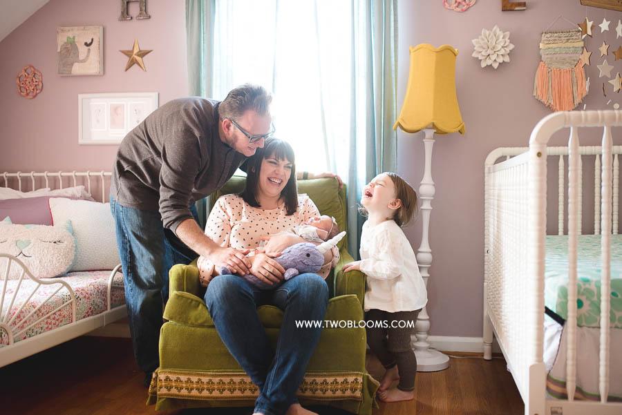 lifestyle newborn photography session of happy family